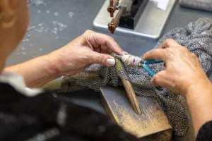 Repairing metal mesh rings in chainmail PPE